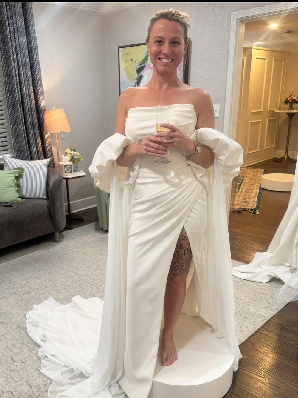 Elegant Strapless White Bridal Gown with Draped Sleeve Detail